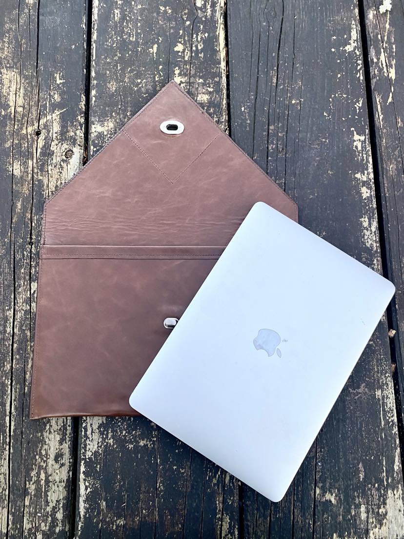 Tan NZ leather laptop case with silver closure.