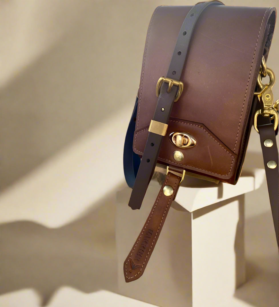 Scotch NZ leather on gold hardware with a twist lock closure.