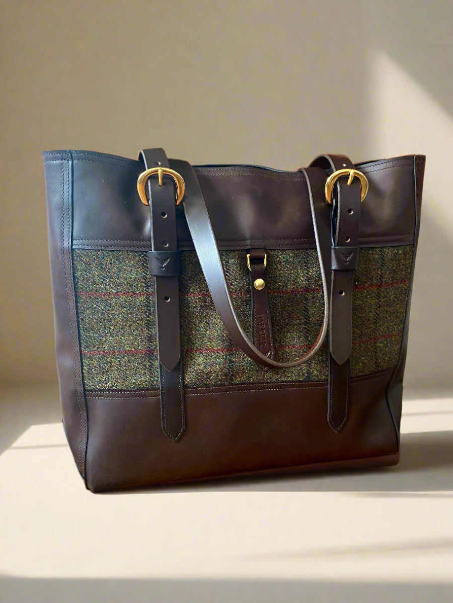 Walnut NZ leather with forest tweed on brass hardware.
