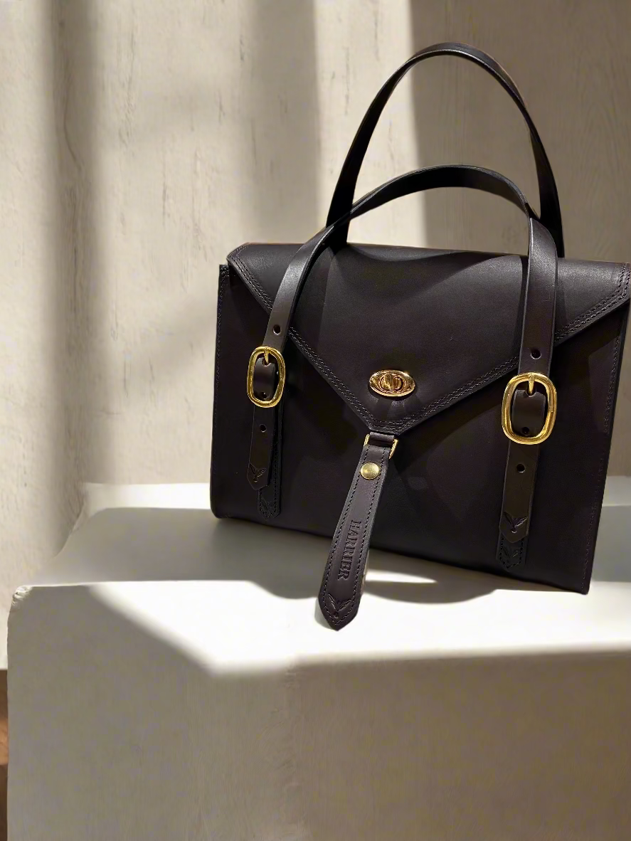Fisher Purse in havana NZ leather with gold hardware.