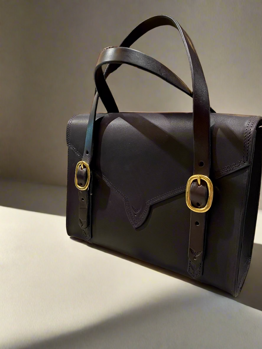 Back View of a havana Fisher Purse with gold hardware.