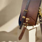 Scotch NZ leather on gold hardware with a twist lock closure.