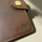 embossed font on a leather passport holder 
