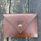 Tan NZ leather laptop case with silver closure and custom laser engraved logo