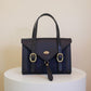 Havana Fisher Purse with navy harris tweed panels and gold hardware. 