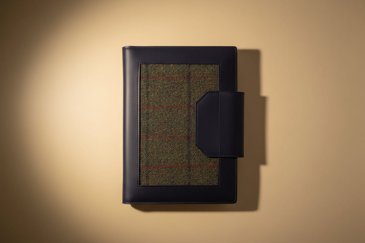 Havana NZ leather compendium with forest harris tweed panels and gold hardware. Back view. 