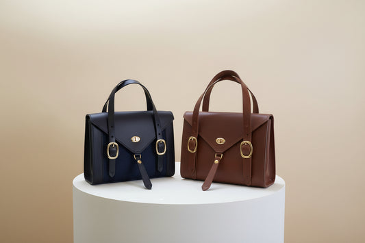 Havana Fisher Purse with navy harris tweed panels and gold hardware and the Scotch Fisher Purse with gold hardware. 