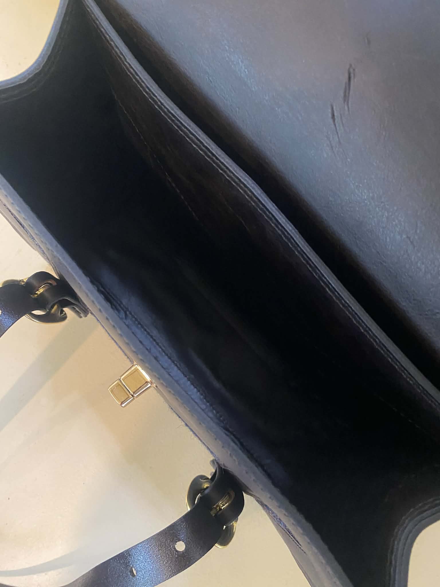 Havana fisher purse with navy harris tweed panels and gold hardware. Inside view.