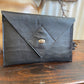 Havana NZ leather laptop case with silver closure.