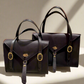 Fisher Purse and Carrow Purse both in Havana leather with gold hardware. 